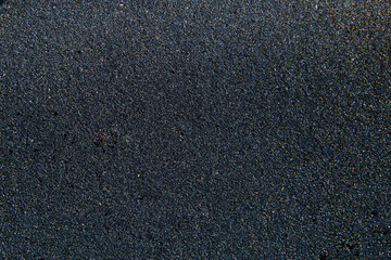 Obraz premium Pattern of black flickering volcanic sand texture. Iceland background
