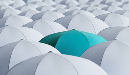 Turquoise umbrella standing out of other ones © New Africa