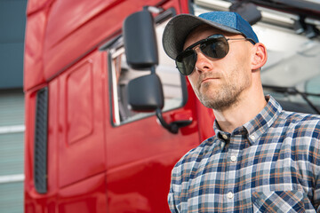 Portrait of Caucasian Truck Driver in Front of His Vehicle