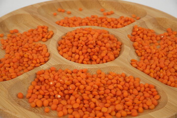 red lentils on a bamboo serving plate
