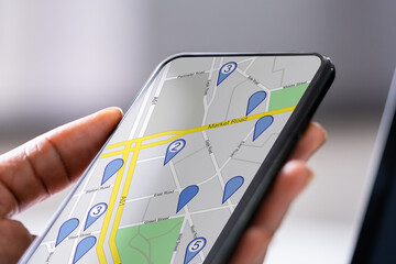 Hand Using GPS Navigation Map