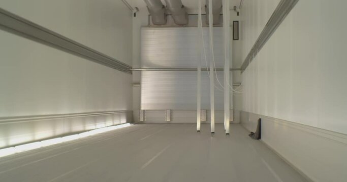 modern freight transport.shot inside a cargo empty clean semi-trailer.Back view close-up.