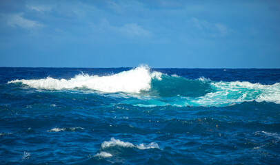 Calm sea water surface texture with splashes and waves. Abstract nature background. Background of aqua ocean water surface.