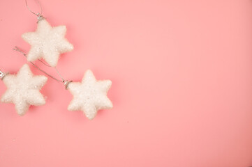 Cute Christmas decorations on pink background copy space