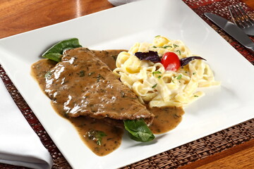 Paillard with fettuccine and sauce