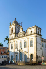 Naklejka na ściany i meble Facade of a antique catholic church created in the 18th century in the Pelourinho district, historic center of Salvador, Bahia