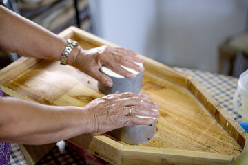 Obraz premium woman preparing homemade soft goat cheese