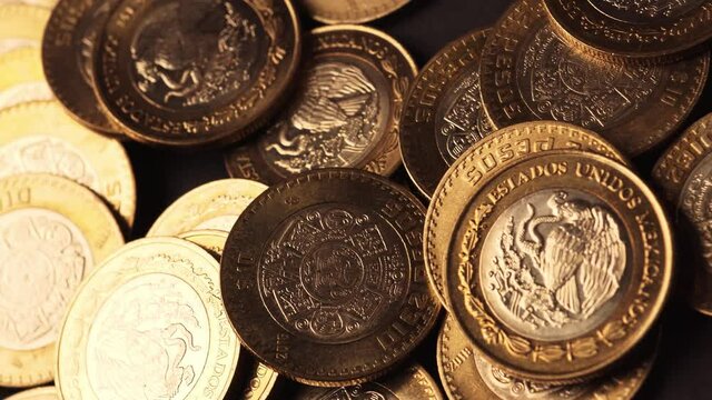 Mexican currency, 10 pesos coins that can represent economy, greed, banking, investment, gold