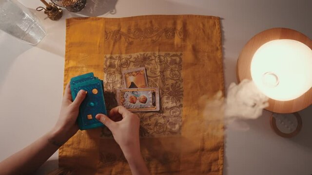 Fortune teller female hands and tarot cards