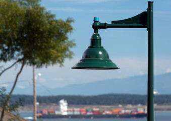 Street lamp on Jefferson Street with cargo ship in the background