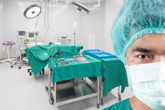 Close up image of mature male surgeon in operating room at modern hospital