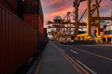 Container cargo in port sunset time with logistics import export and transportation concept