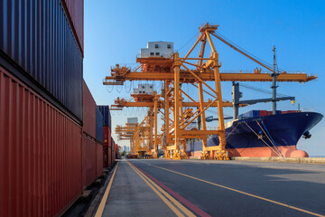 Container loading in a cargo freight ship with ports crane bridge loading export containers box in...