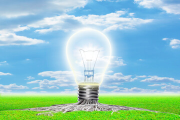 Concept of creativity and the rise of ideas as a light bulb emerging out from underground roots as a success metaphor