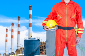  Engineer holding helmet for working at modern thermal power plants
