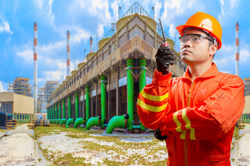 Technician with radio communication in action for working at cooling tower of Industrial power plant