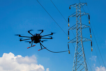 Drone stringing transmission lines of electrical high power. stringing via our method reduces cost...