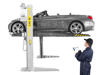 Auto mechanic Inspection suspension system of the car lifting for under repair isolated on a white...