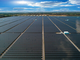 Solar energy farm for clean renewable energy from the sun in blue sky