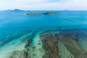 Aerial view drone shot of tropical sea at rawai beach Phuket Thailand Beautiful scenery andaman sea and small island in summer season Beautiful travel background and website design nature view