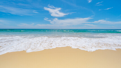 Tropical sandy beach with blue ocean and blue sky background image for nature background or summer background
