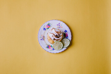 Isolated lemon pie on vintage flower plate