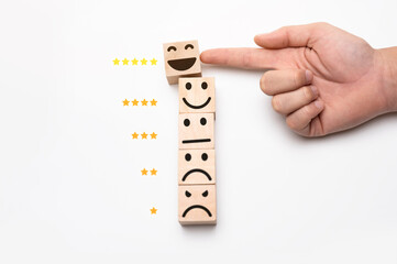 Highest quality of service. The hand of the customer rated the highest satisfaction with 5-star rating. Best service, Survey, The wooden block has an emoticon