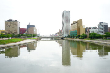 Fototapeta na wymiar Murasaki River and Cityscape of Kokura in Kita-Kyushu, Fukuoka, Japan - 日本 福岡 北九州 小倉の街 紫川
