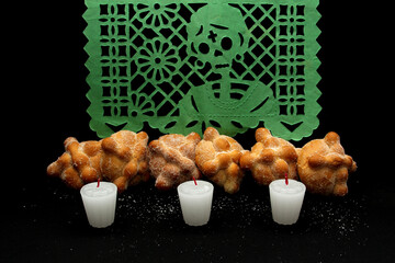 Delicious, fresh and fluffy freshly baked bread of the dead put on an altar for the Day of the...