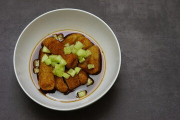 Pempek, mpek-mpek or empek-empek is a savoury Indonesian fishcake delicacy, made of fish and tapioca, from Palembang, South Sumatera, Indonesia.