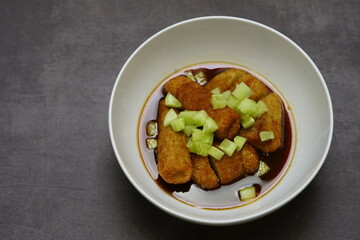 Pempek, mpek-mpek or empek-empek is a savoury Indonesian fishcake delicacy, made of fish and tapioca, from Palembang, South Sumatera, Indonesia.