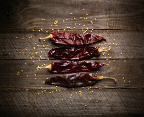 chili peppers on wooden background