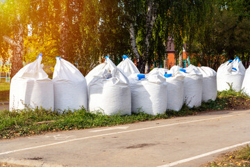 Large white bags of gravel on a construction site