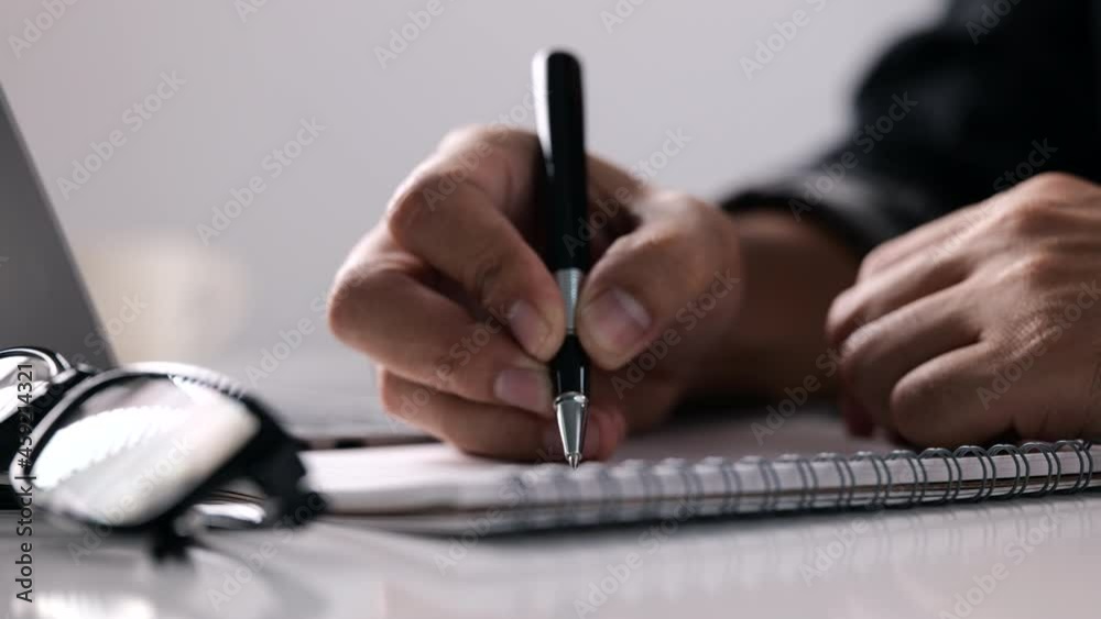 Poster Man writing on a notebook, E-learning online study concept, student study online class via laptop computer