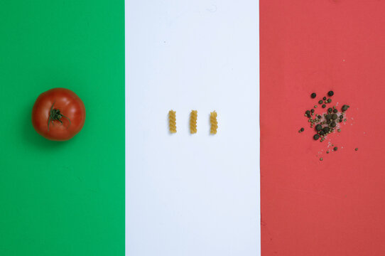 basic fossili pasta ingredients over Italian flag