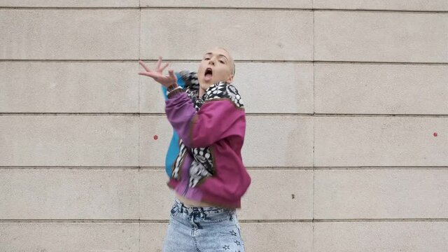 young non binary model dancing in the street for viral video