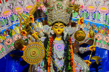 Beautiful face of Goddess Durga idol with her full glory, Durga Puja festival at night. Shot under...