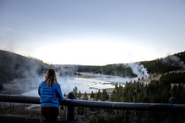 Adventurous Girl exploring the outdoors with blaze orange hat and vibrant blue jacket. 