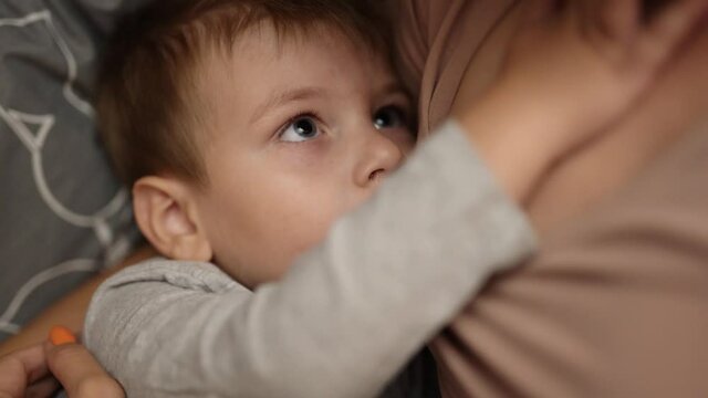 Mom breastfeeds 3 year old son