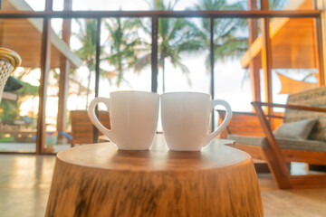 Morning coffee at sunrise in a cosy beach house