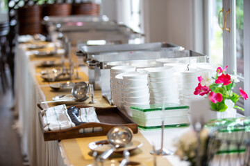 Empty catering plates, platters and trays setup before event. Equipment setup for buffet 