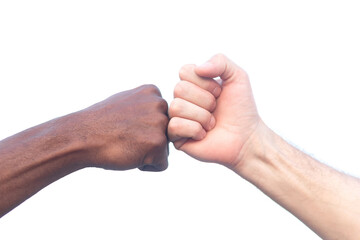 Close-up of a black African and a white Caucasian holding hands