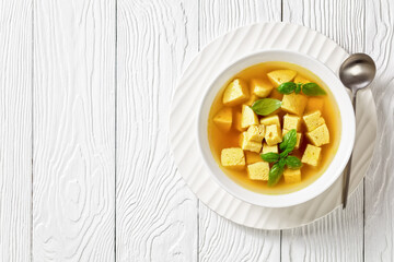 soup of chicken broth with parmesan egg dumplings