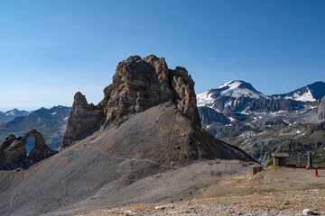 Fototapeta premium Mountain landscape with a rock arch in summer in the French Alps à Tignes 