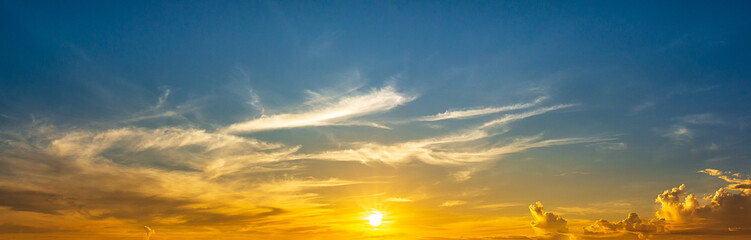 Panoramic view of the sky with shining sunrise and clouds, nature wallpaper