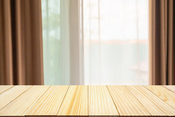 Empty wood table top with window curtain abstract blur background for product display