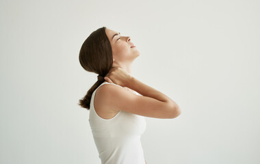 Fototapeta premium brunette in white t-shirt joint pain health problems dissatisfaction