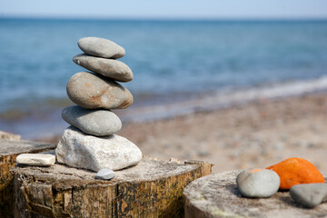 stones stacked on top of each other against the background of the sea