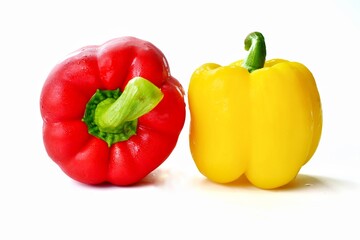 red and yellow peppers isolated on white