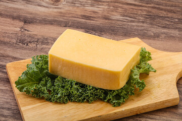 Tasty yelloow Tilsiter cheese brick